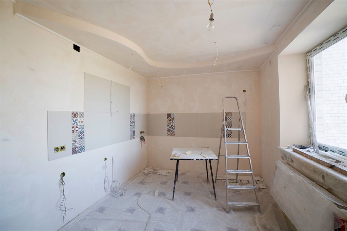 Room mid-renovation with tile samples